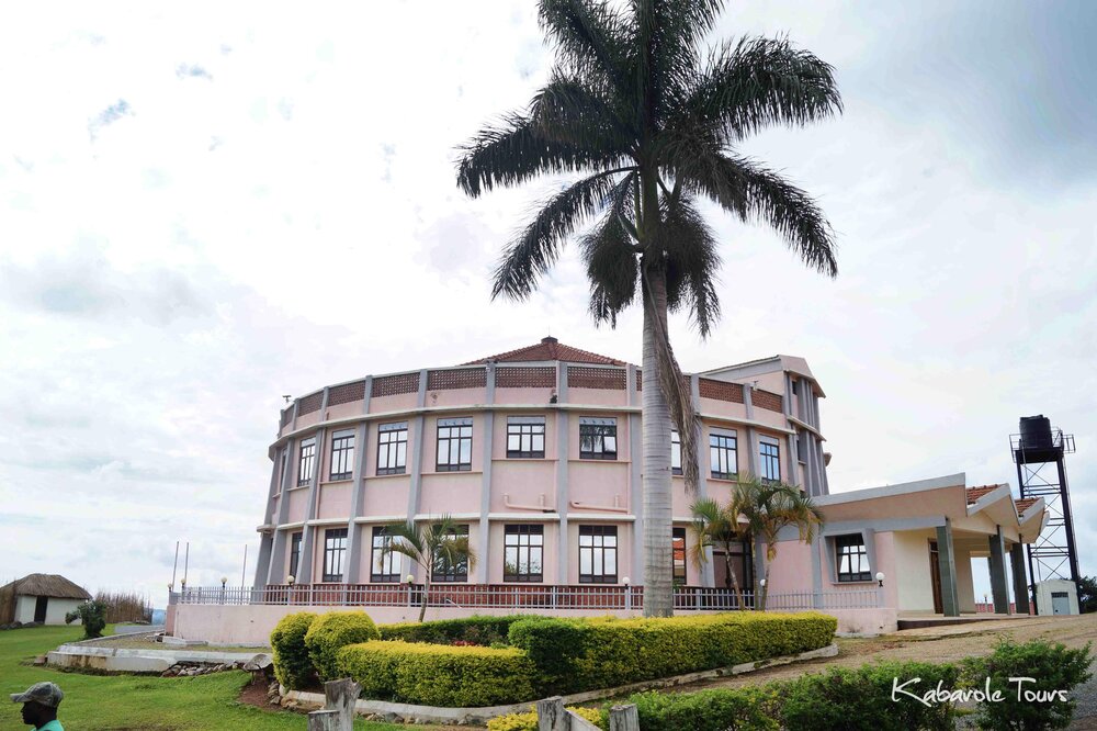 The official Karuziika Palace of the Toro Kingdom royal family in Fort Portal, Uganda, featuring the circular building and traditional palm tree