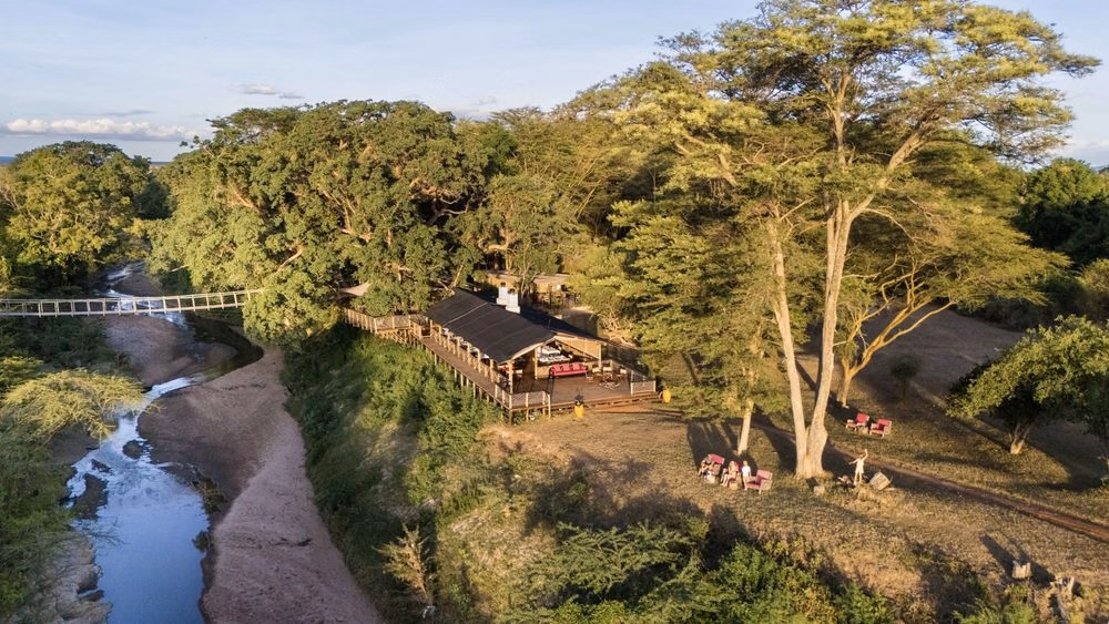 Basecamp Masai Mara beside the river and surrounding savannah in Kenya